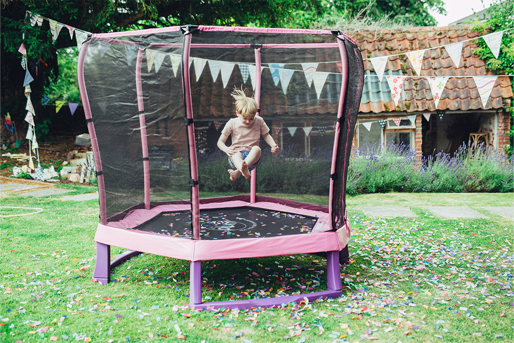 child jumping on plum junior trampoline 