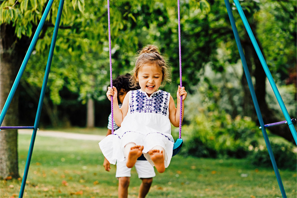 Happy child on swing